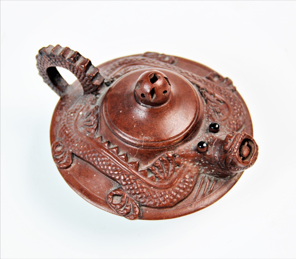 A Chinese Yixing terracotta teapot, decorated with a stylised dragon, removable cover with pierced - Image 2 of 2