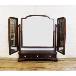 A 1920's Chinese Chippendale revival mahogany triple dressing table mirror, the three bevelled