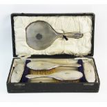 A George V silver back dressing table set, F R Gomm, Birmingham 1919, comprising; a hand mirror, two