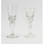 A 19th century wine glass, of typical form, with Jacobite style floral engraving, knopped