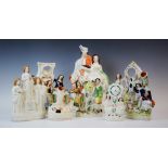 A group of Staffordshire flatback figures, 19th century and later, to include: a figural group of