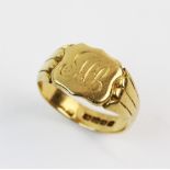 An 18ct gold signet ring, the central cartouche with engraved letters 'MP', 11mm x 13mm,