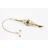 An Edwardian seed pearl set bar brooch, comprising an untested old-cut blue gemstone measuring