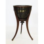 A Regency style mahogany jardinière stand, 20th century, with a brass domed bowl within a tapering