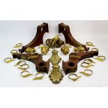 A collection of brass and gilt metal curtain pole fittings, to include a pair of wall bracket pole