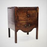 A George III mahogany tray top commode/cabinet, with a pierced gallery above a pair of cupboard