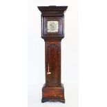An 18th century oak cased single finger longcase clock signed James Leigh Fecit, with an overhanging