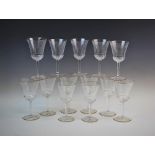 A set of seven red wine glasses, 20th century, the glasses with finely fluted trumpet bowls above