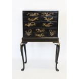 An early 20th century Japanned specimen chest on stand, the rectangular cabinet with an