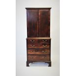 A George III mahogany collectors cabinet on chest, with a cavetto cornice above a pair of cross