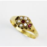 A Victorian pearl and ruby cluster ring, comprising two mixed cut rubies and five small pearls in