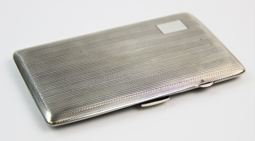 A silver cigarette case, John Rose, Birmingham 1943, of rectangular form, with striped and engine - Image 2 of 3