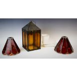 An early 20th century copper oxidised hanging lantern, of architectural form with four amber glass