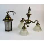 An early 20th century brass three branch ceiling light fitting, the three scrolling arms extending