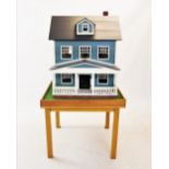 An early American dolls house, probably 1930s or 1940s, the house with two storeys, an attic with