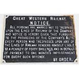 A cast iron railway sign, of rectangular form, cast in relief with white painted text upon a black