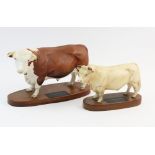 Two Beswick Connoisseur models, one of a Hereford bull, 19cm high, and one of a Charolais bull, 15cm