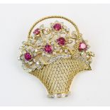 A diamond and ruby set 18ct gold giardinetto brooch, comprising six untested mixed cut rubies,