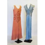 A collection of early 20th century lady's clothing, to include, a duck egg blue dress with foliate