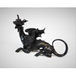 A painted cast metal dragon figural chamberstick, 20th century, applied with a candle sconce between