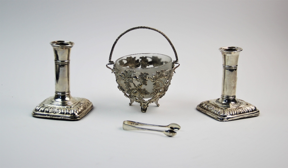 A pair of Victorian silver candlesticks, I S Greenberg & Co, Birmingham 1899, each with plain