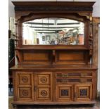 A late 19th/ early 20th century oak and pollard oak mirror back sideboard by E Goodall & Co,