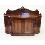 A Victorian mahogany chiffonier /sideboard, the shaped raised back centred with a carved scrolling