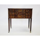 A George IV mahogany dressing chest, the rectangular hinged top with rosewood cross banding