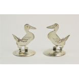 A pair of silver place card holders, Sampson Mordan & Co Ltd, Chester 1912/1914, each modelled as