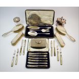A silver backed dressing table set, Synyer & Beddoes, Birmingham 1914, comprising: a hand mirror,