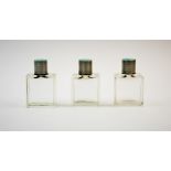A set three George V silver and enamel topped scent bottles, Goldsmiths & Silversmiths Co Ltd,