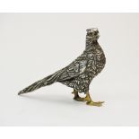 A white metal pheasant, the feather body decorated with striated details and gilt feet, stamped '