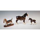 A Beswick model of a bay Clydesdale shire horse, modelled with ribbon tied mane, along with a