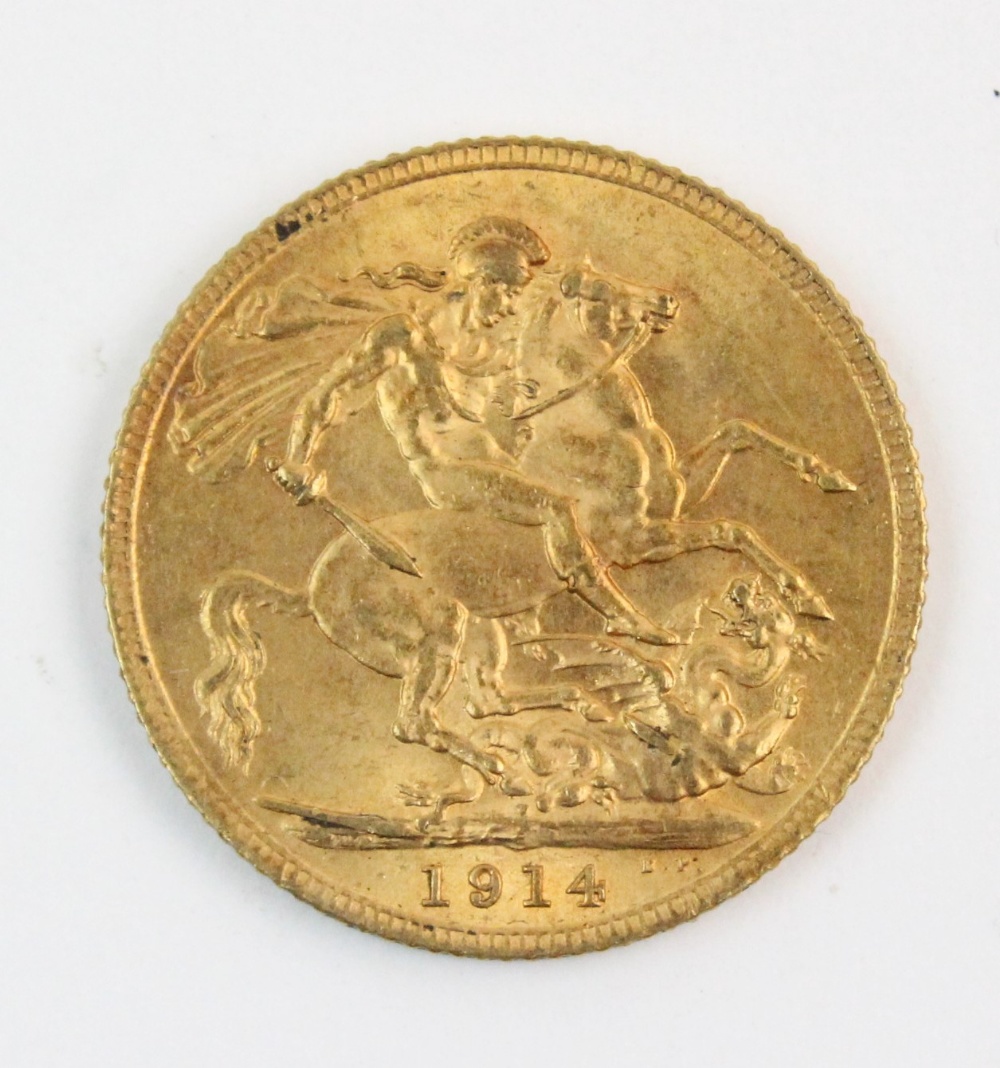 A George V sovereign, dated 1914, weight 8.0gms