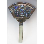 A 19th century Chinese champleve enamel mirror, the fan form back with polychrome enamelled design