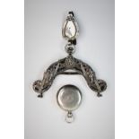 A late 19th century continental white metal purse clasp, decorated with three figural panels, amidst