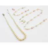 A suite of pearl and 14ct gold jewellery, including a necklace comprising seventeen off-round