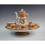 A Copeland coffee service on lazy Susan serving stand, circa 1851-85, hand painted in iron red
