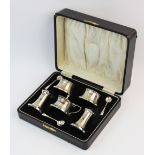 A silver Art Deco condiment set, Joseph Gloster Ltd, Birmingham 1934, each piece of waisted form,