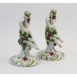 A pair of Derby 'Dry-edge' figural candlesticks, c.1753-55, each modelled as a Bacchanalian cherub