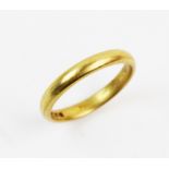 A 22ct gold band, plain polished exterior, ring size O, weight 4.2gms