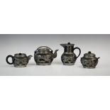 A Yixing pewter mounted four piece tea service, each piece overlaid with a fiery dragon, hot water