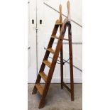 A vintage Simplex stepladder, the stained pine six rung ladders, applied with articulated iron