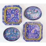 A pair of late 19th/early 20th century cloisonne trays, of square canted form, enamelled with