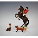 A Beswick huntsman on rearing horse, model No 868, designed by A Gredington, 23.5cm high, with a