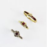 A ruby and diamond floral cluster ring, comprising a central mixed cut ruby with a cluster