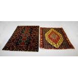 An ethnic pattern wool pile rug, with three geometric medallions upon a blue ground within flower