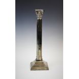 An early 20th century silver plated candlestick, designed as a Corinthian capital, atop a stop-