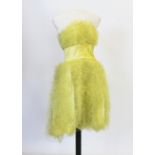 A canary yellow cocktail length ruffle dress, early 1960s, the bodice constructed of horizontal