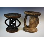 Two Southern African tribal Shona or Tsonga carved wooden stools, 33cm high and 27cm high (2)